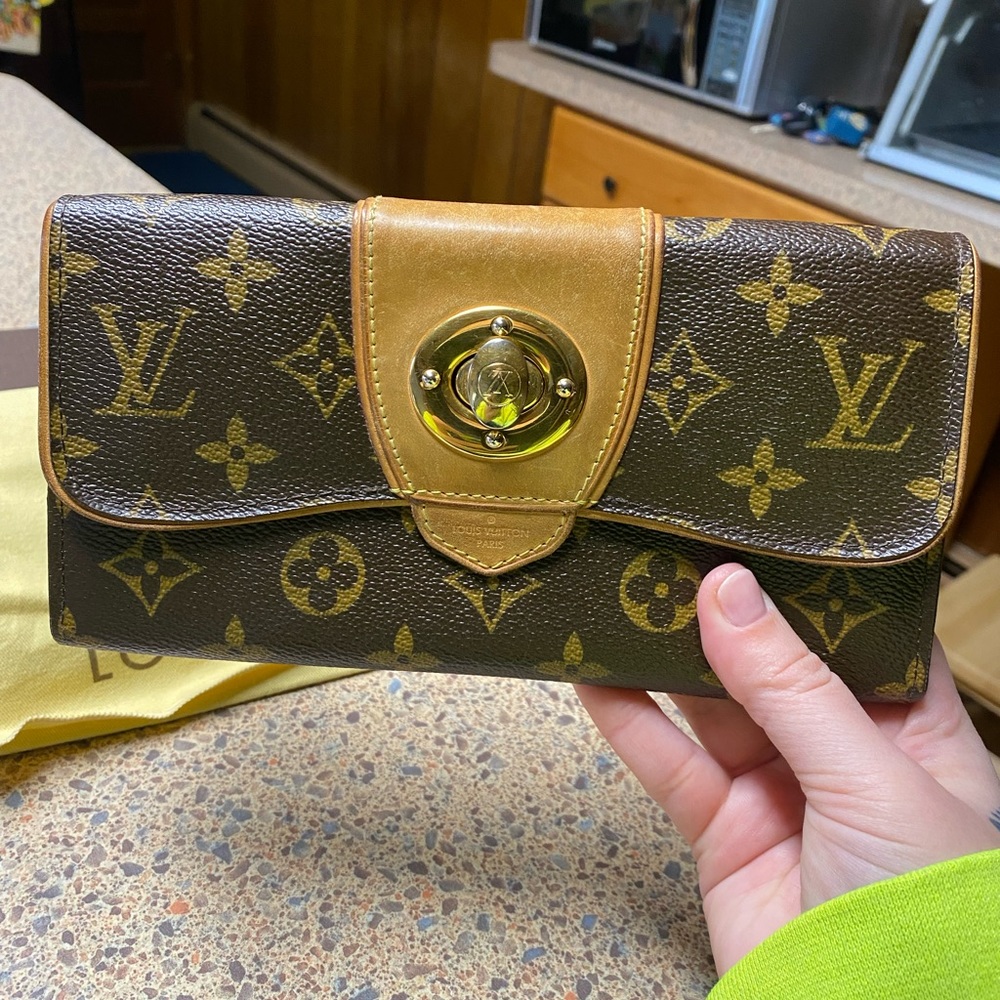 Louis Vuitton P.F. Boetie Monogram wallet.